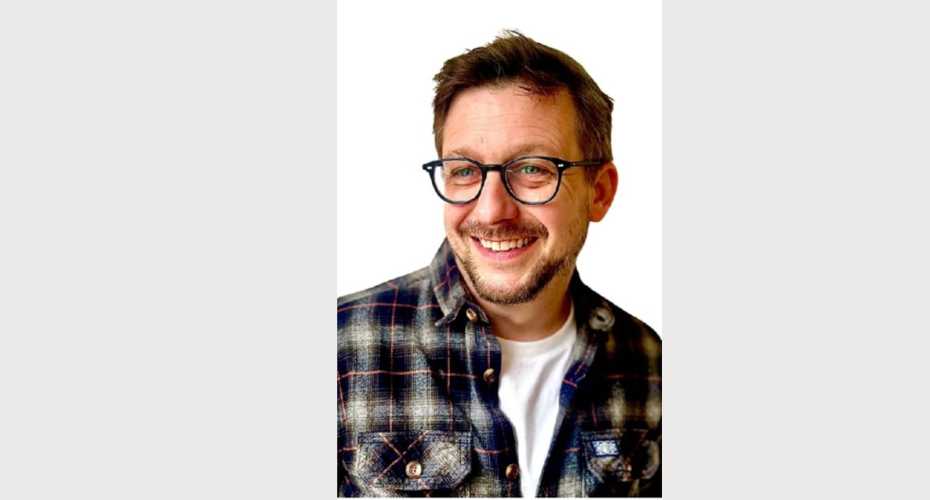 Head and shoulders photo of alumnus Dan Jeffery who is smiling and looking slightly to the side