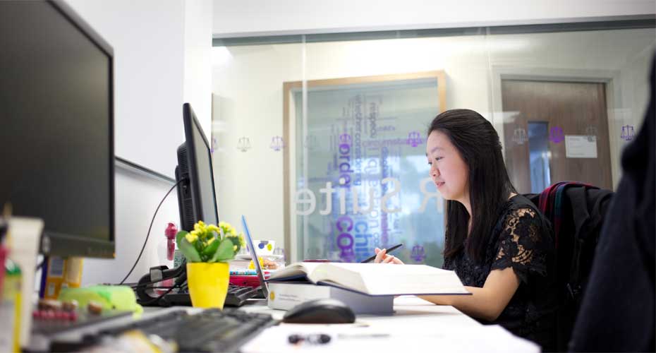 Woman at computer in office